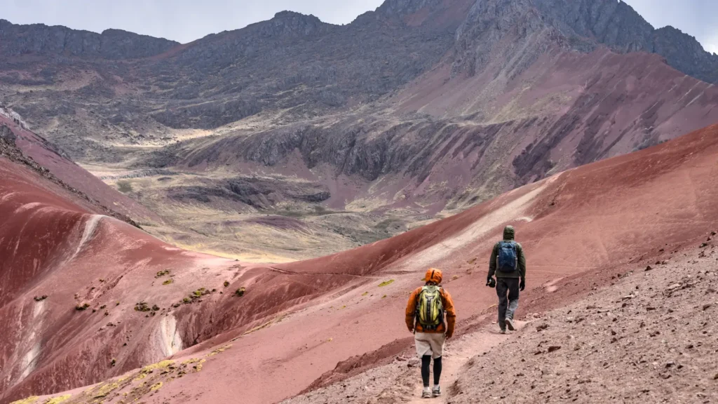 Hiker resting during the Rainbow Mountain Vinicunca trek