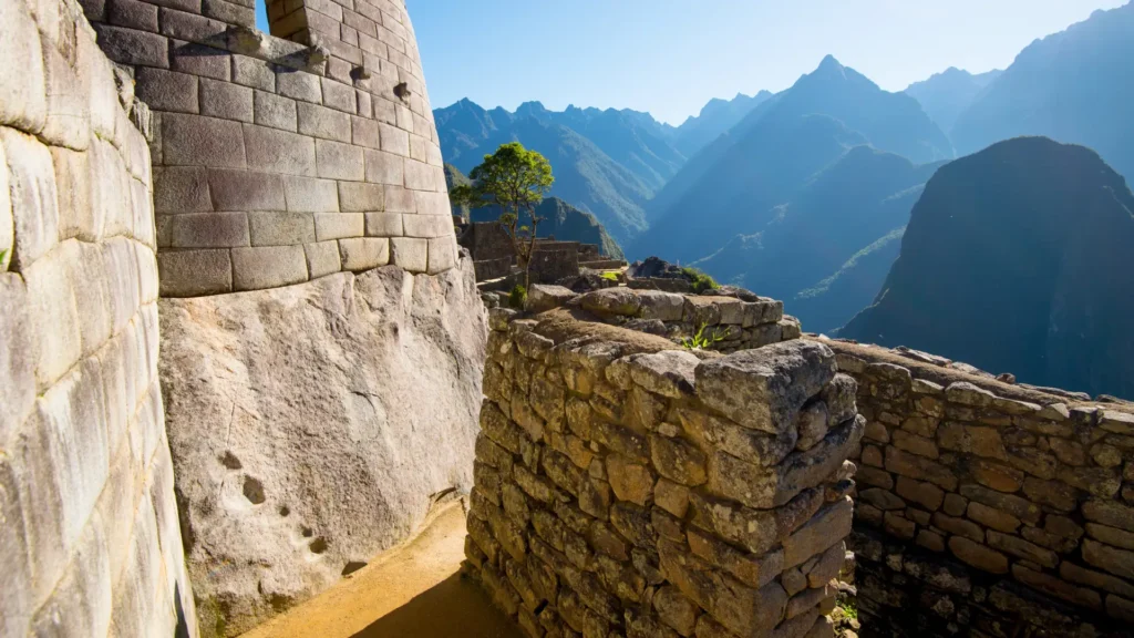 Detailed close-up of the precision Incan stonework at the Temple of the Sun, a highlight of two day tours of Machu Picchu